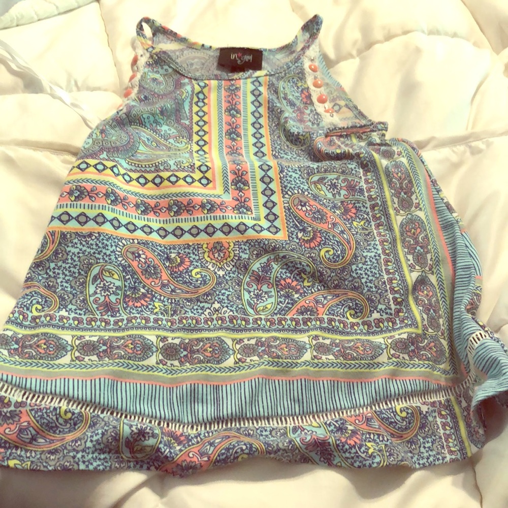 Cute halter top with button detail.